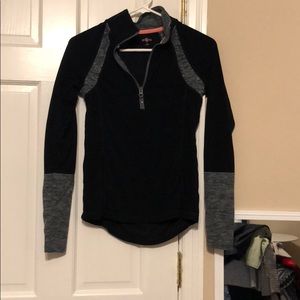 Black and gray pull over with zipper and pockets